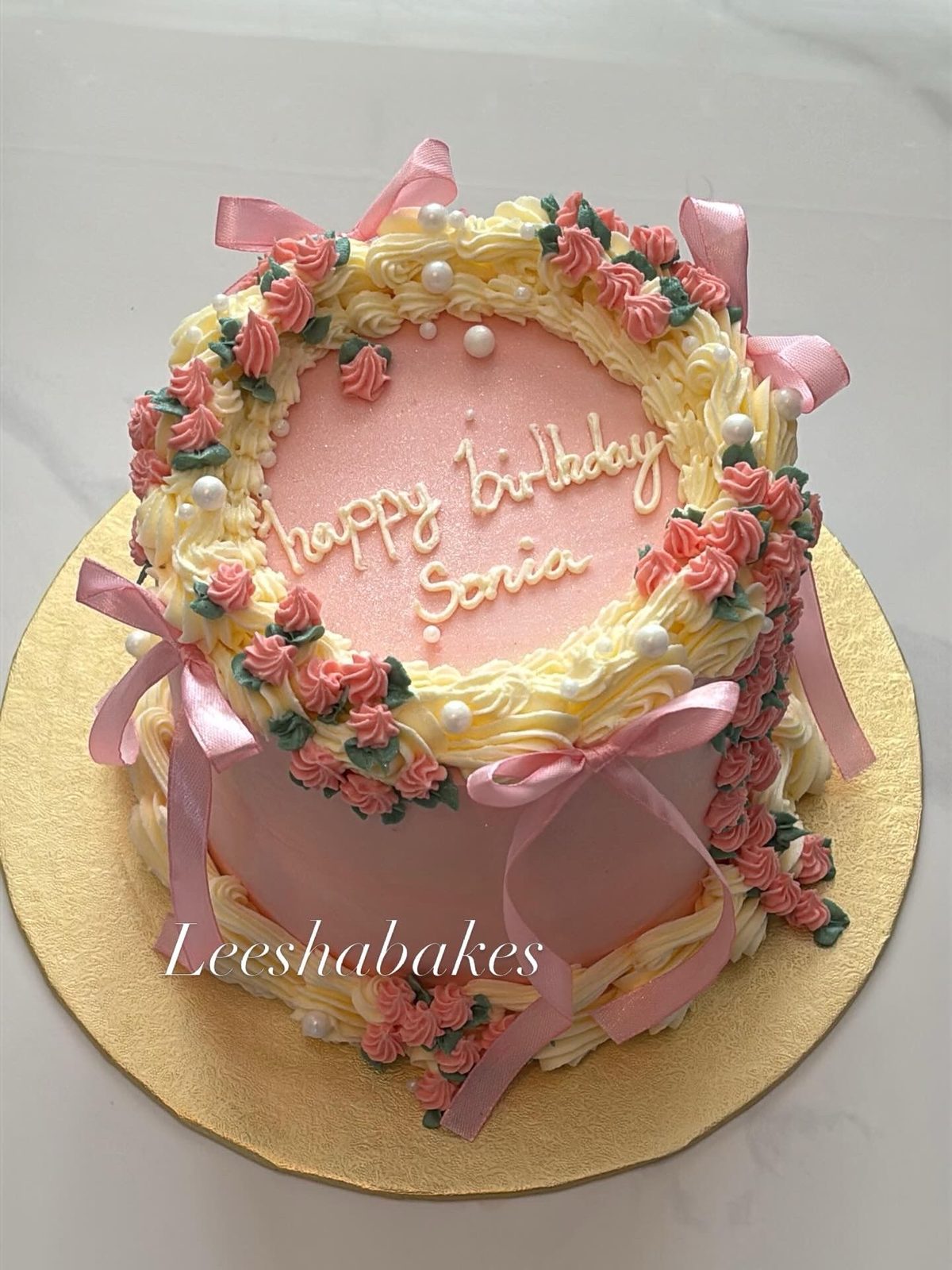 Pink and cream cake with pink roses