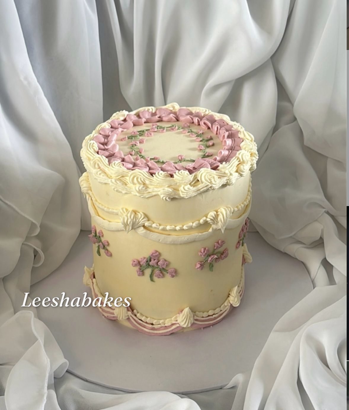 Vintage cream cake with pink flowers