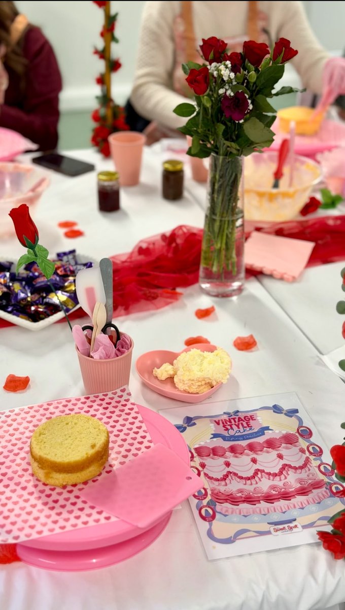A mini sponge cake ready to decorate at a workshop station